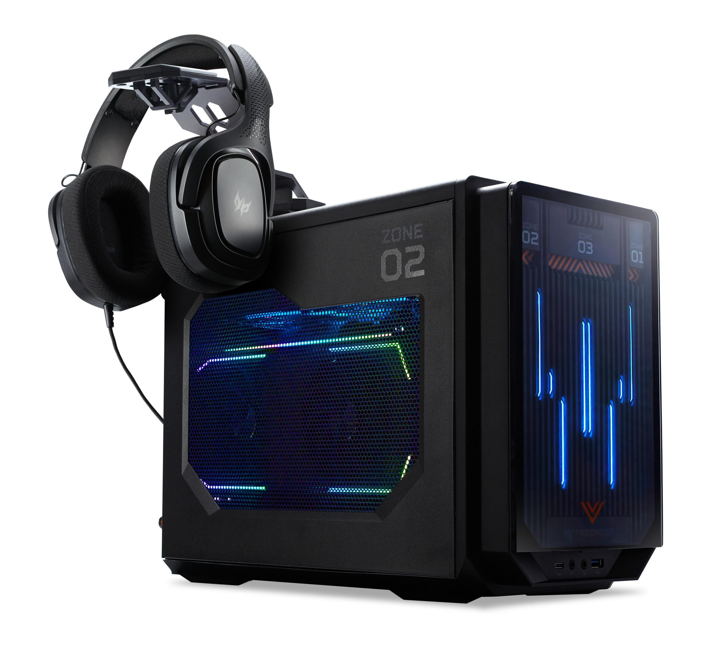 Schwarzes Computergehäuse mit Headset oben. Gehäuse hat Display, Headset liegt auf.