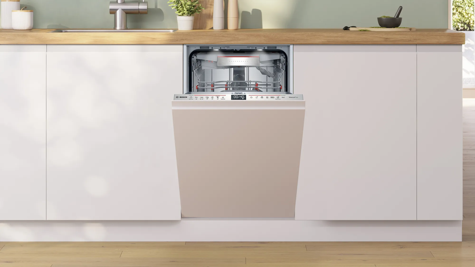 Una lavastoviglie Bosch installata in cucina. La porta è beige, aperta.