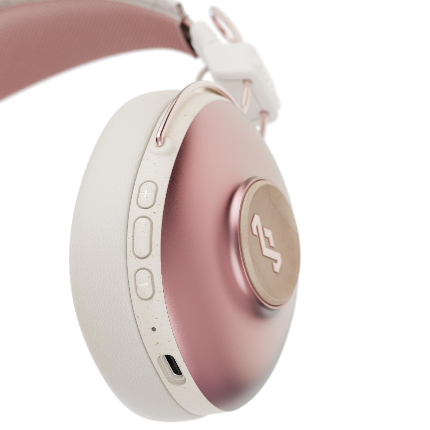 Roze en witte koptelefoon met knoppen aan de zijkant.