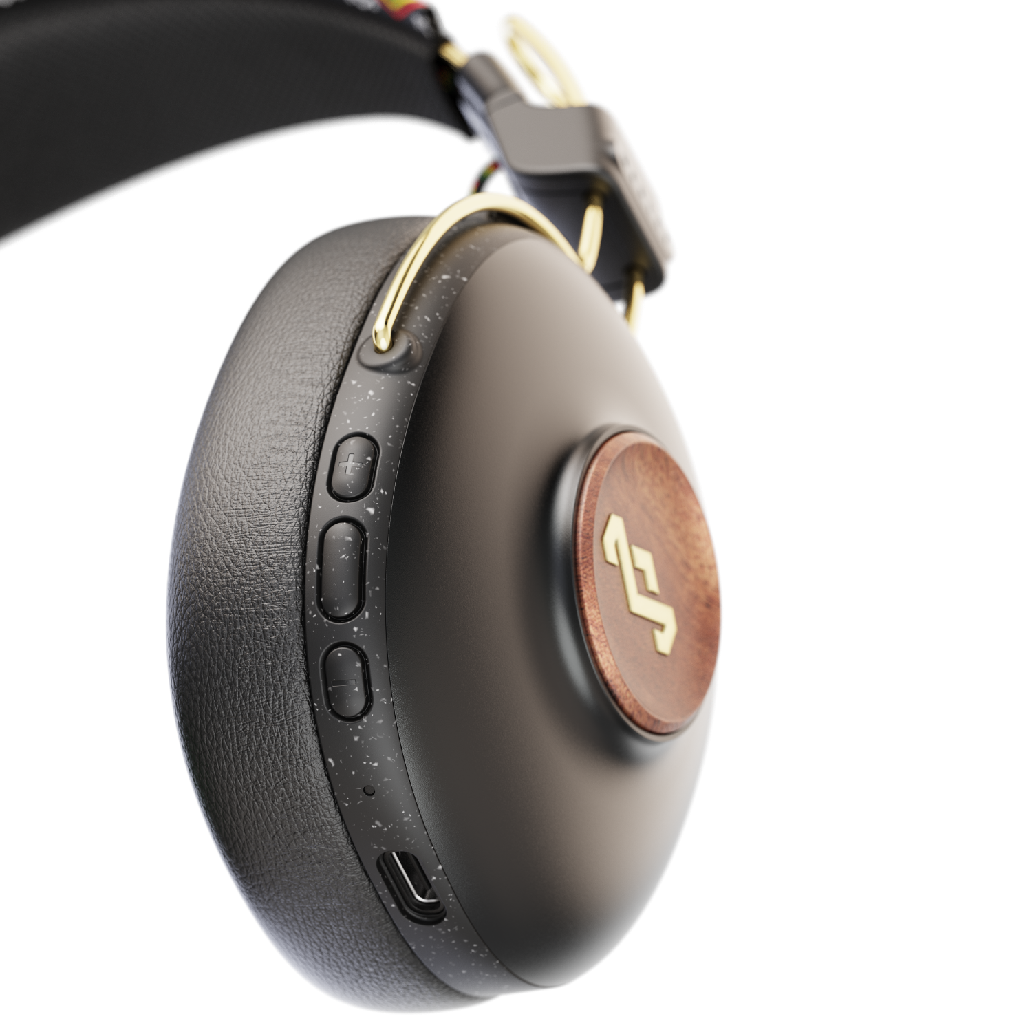 Headphone, black with wood accent, isolated on black background.