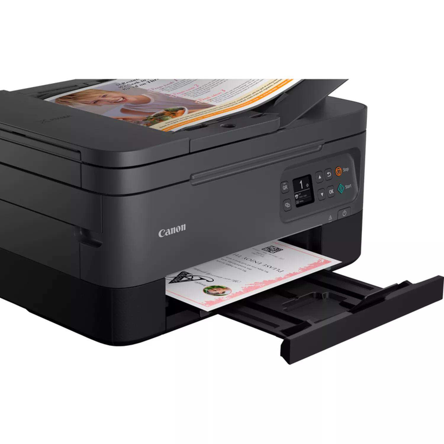 Schwarzer Canon-Drucker, der ein Papier mit einem Bild bedruckt.