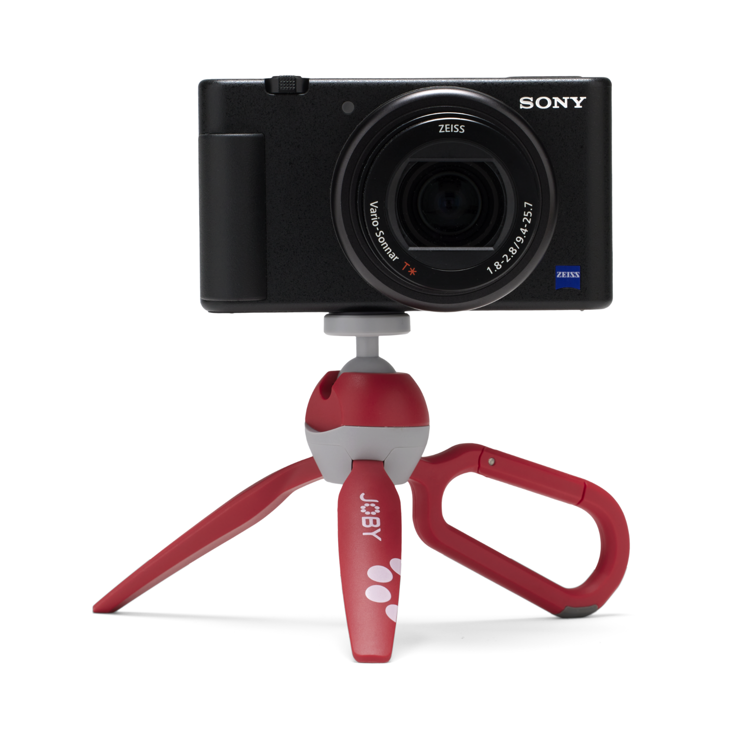 Zwarte camera op een rood en grijs statief, zwarte achtergrond.