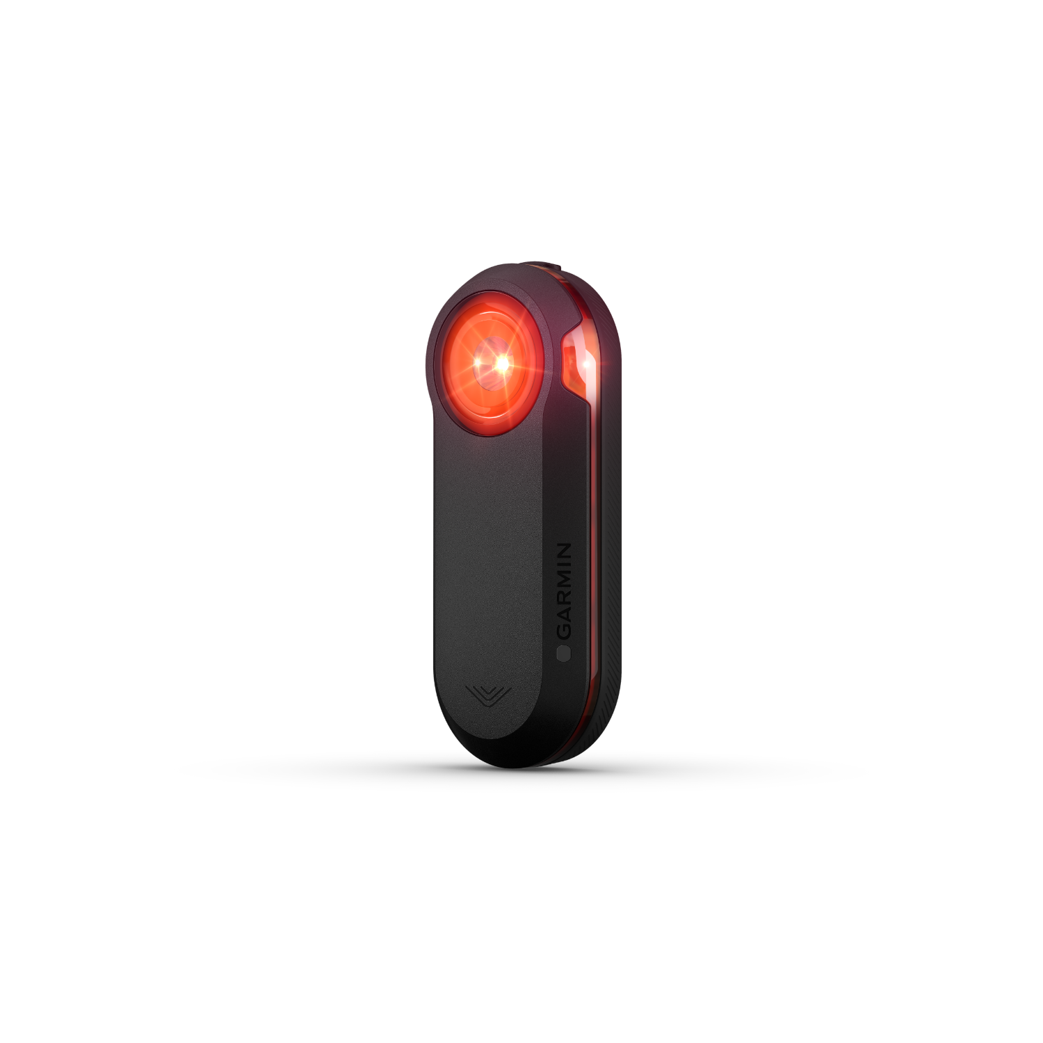 Zwart Garmin fietslicht met rood licht aan, tegen een zwarte achtergrond.