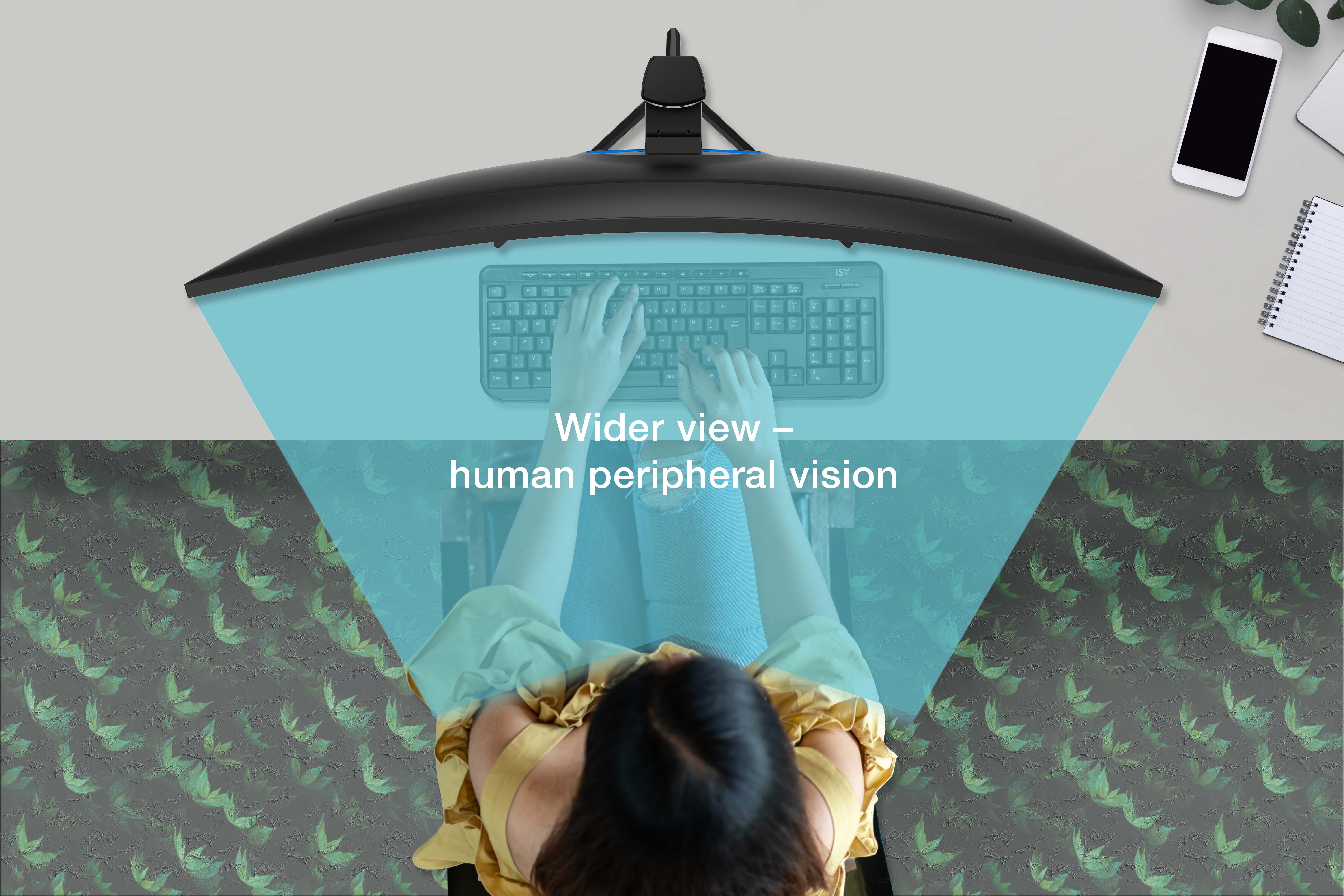 Persona che digita sulla tastiera sotto un monitor curvo, vista del motivo delle foglie.