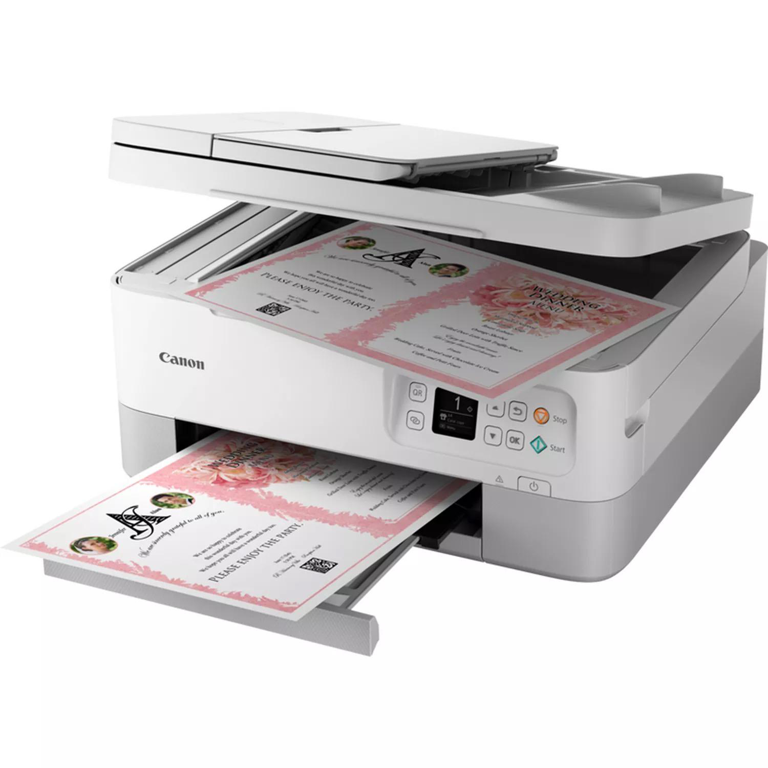 Ein Canon-Drucker mit zwei Papierbögen mit Bildern und Text, vor weißem Hintergrund.