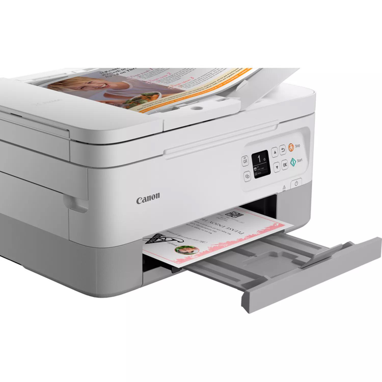 Ein weißer und grauer Canon-Drucker, der eine Seite mit einem Foto druckt.