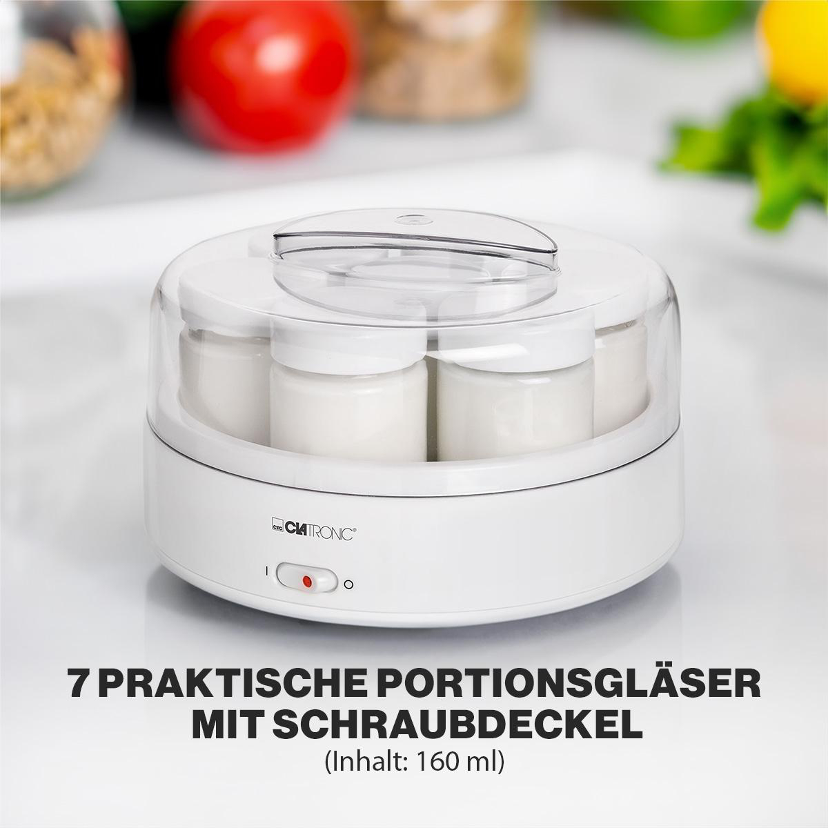 Ein weißer Joghurtbereiter mit sieben weißen Gläsern und einem transparenten Deckel wird gezeigt.