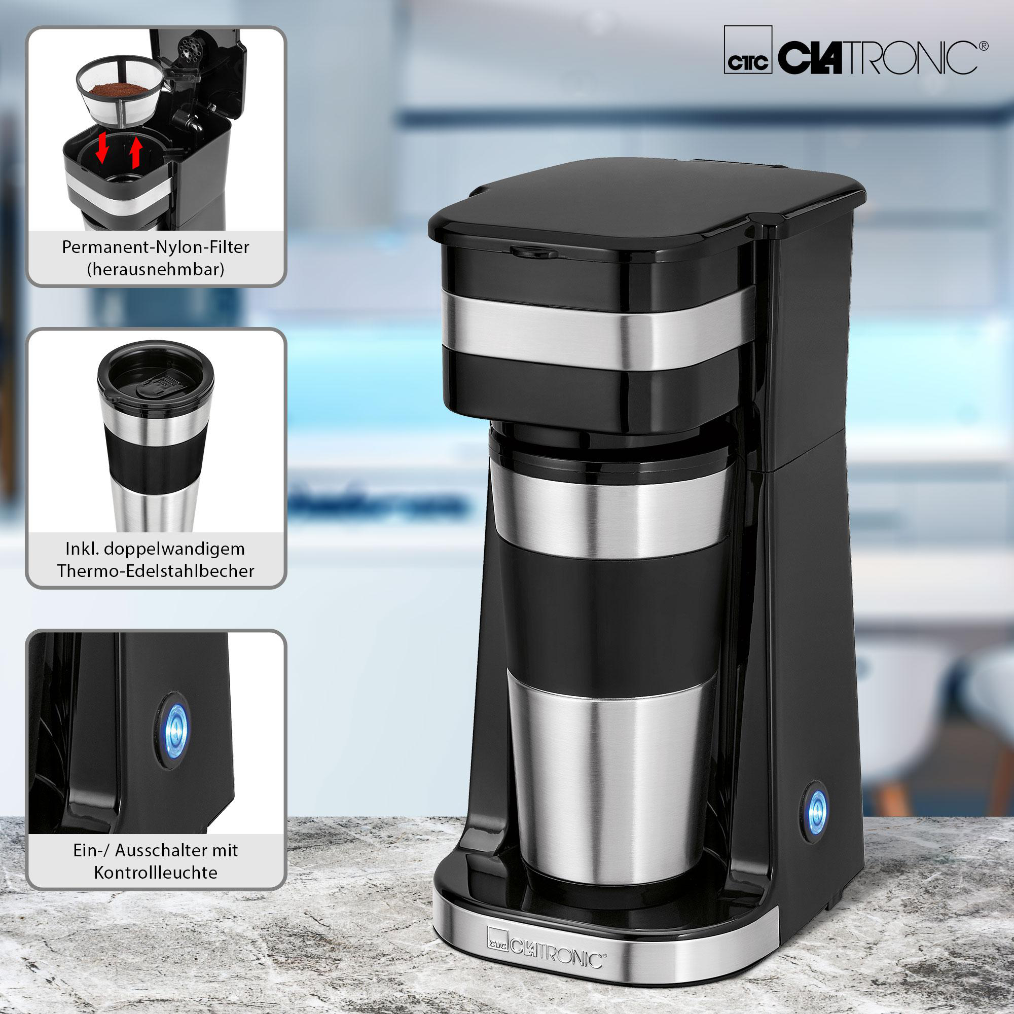 Schwarz-silberfarbene Kaffeemaschine mit Thermobecher und Infoetiketten.