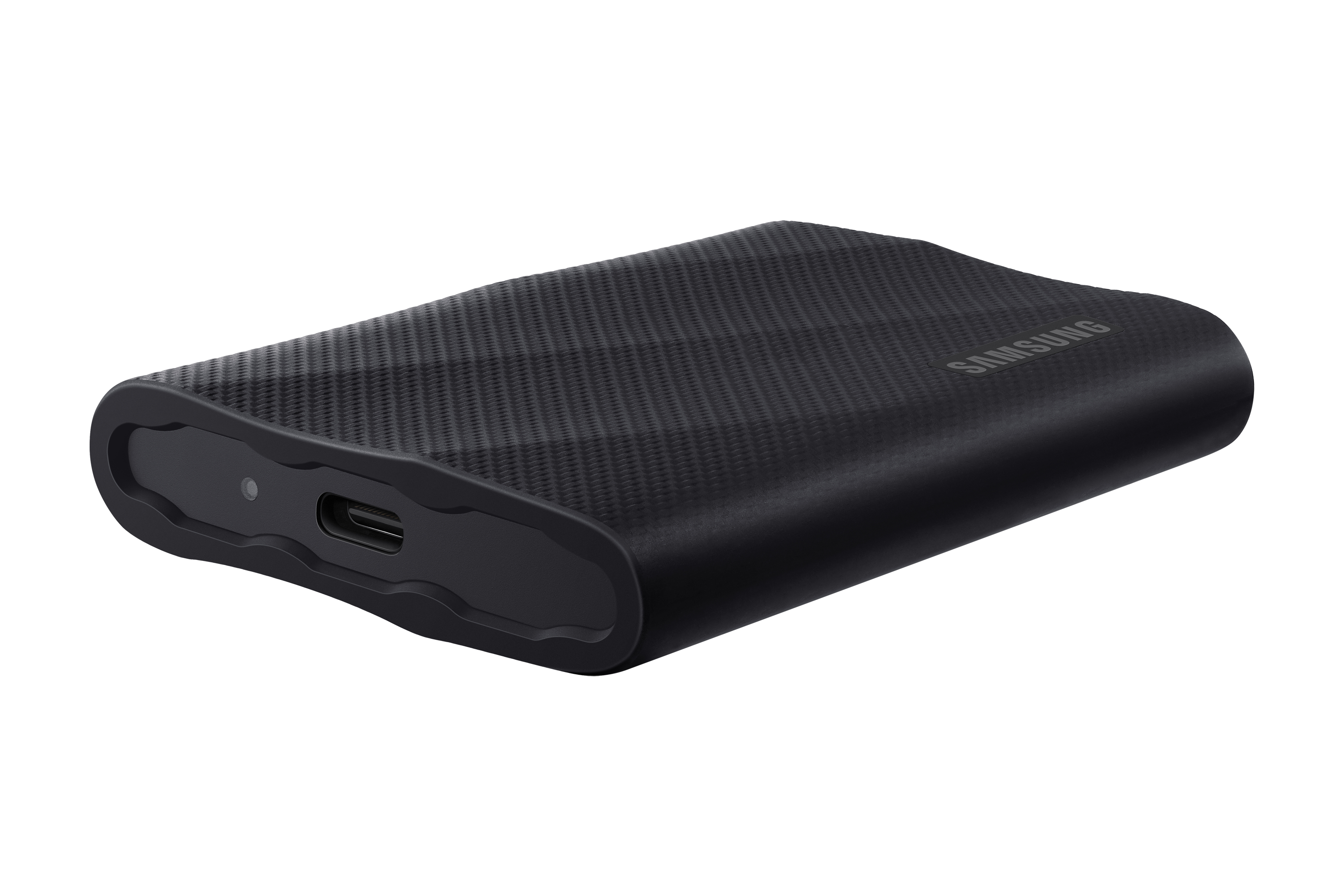 Disco duro portátil negro con textura de fibra de carbono y puerto USB-C.