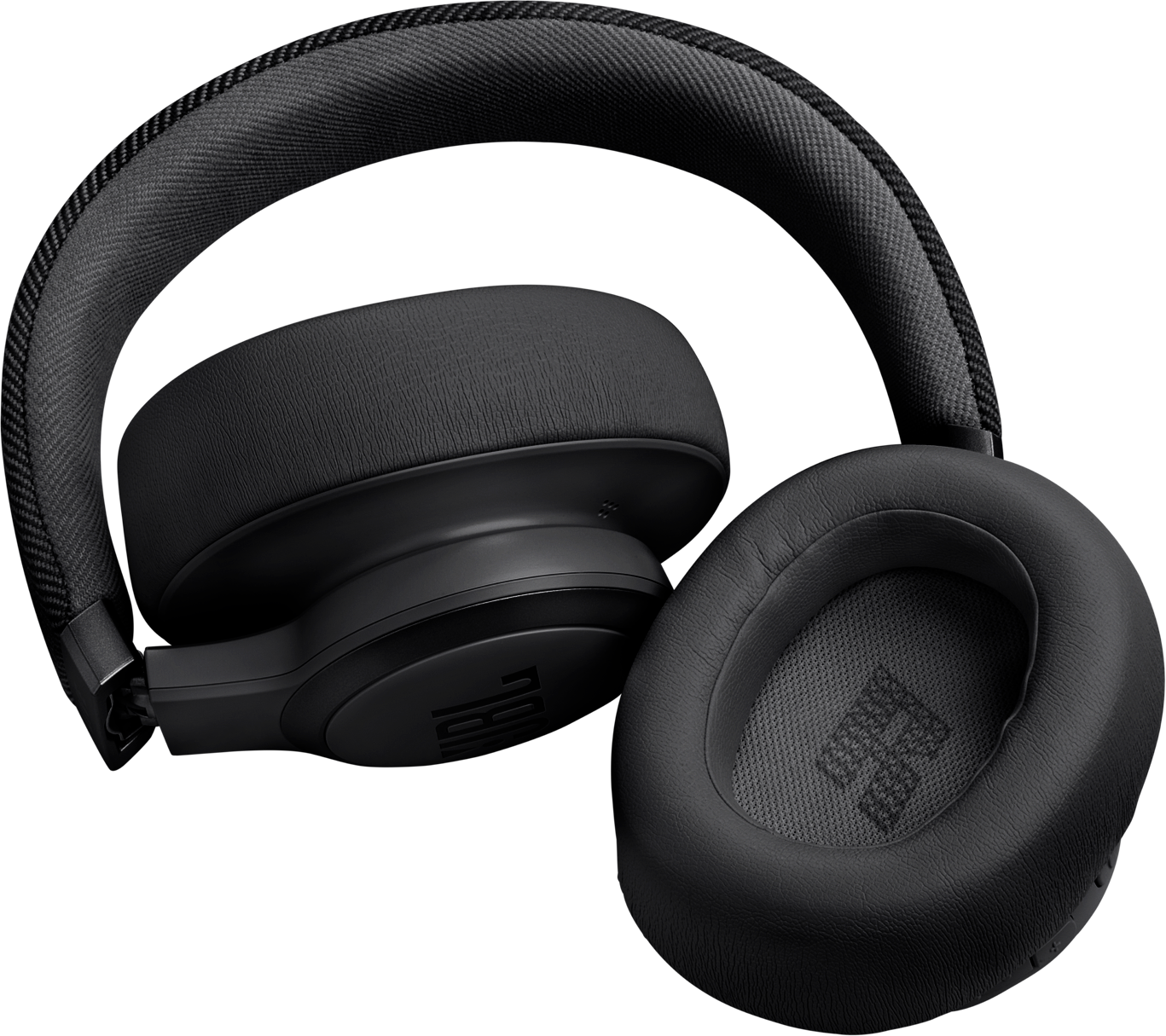 Cuffie JBL nere su sfondo nero, primo piano.