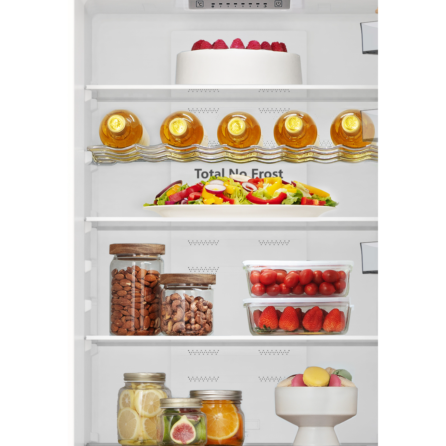 Inside a fridge: cake, wine bottles, salad, jars of nuts, tomatoes, strawberries, lemons, figs, oranges, and macarons.