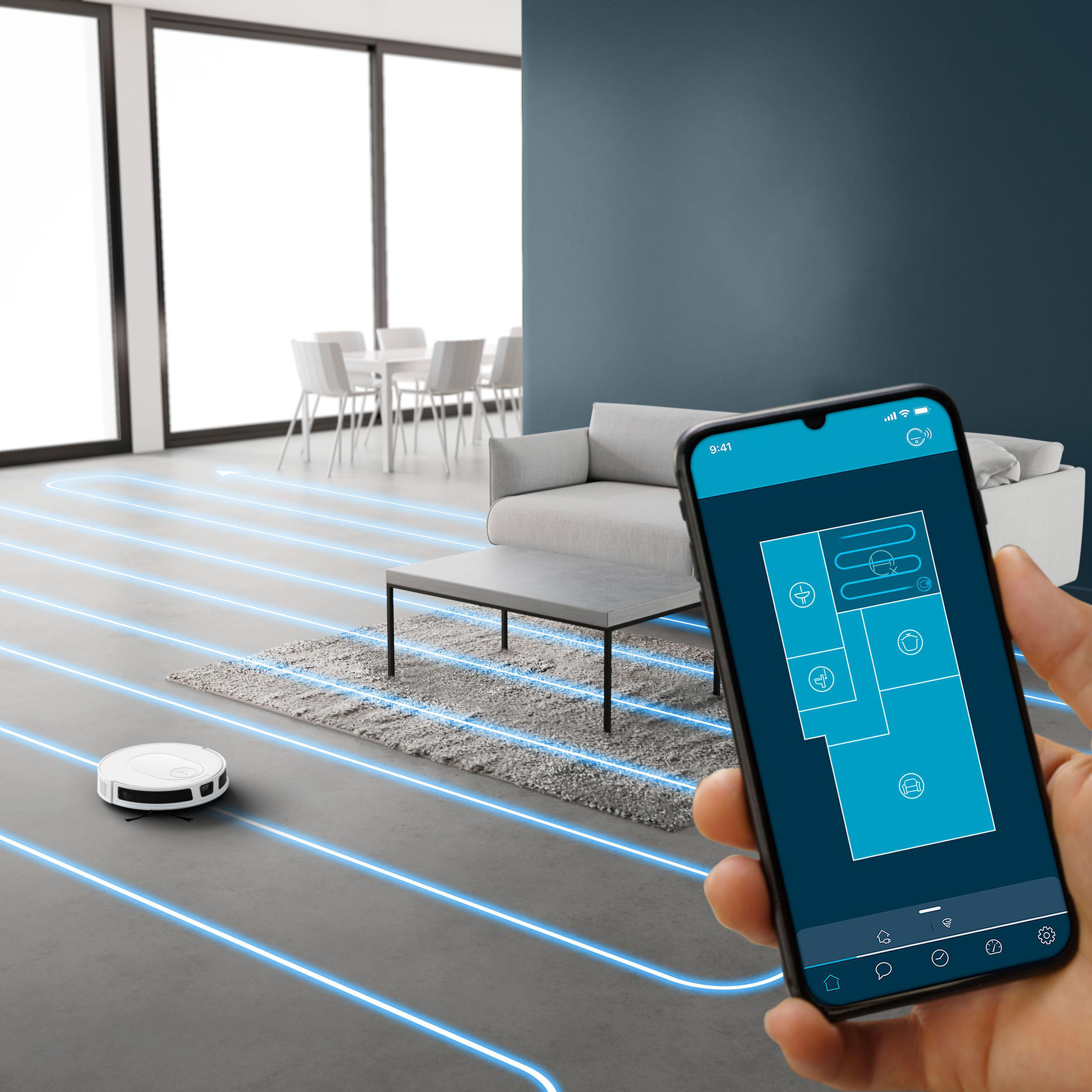Ein Roboter-Staubsauger reinigt einen Raum. Ein Telefon zeigt eine Karte des Raums und verfolgt den Weg des Staubsaugers.
