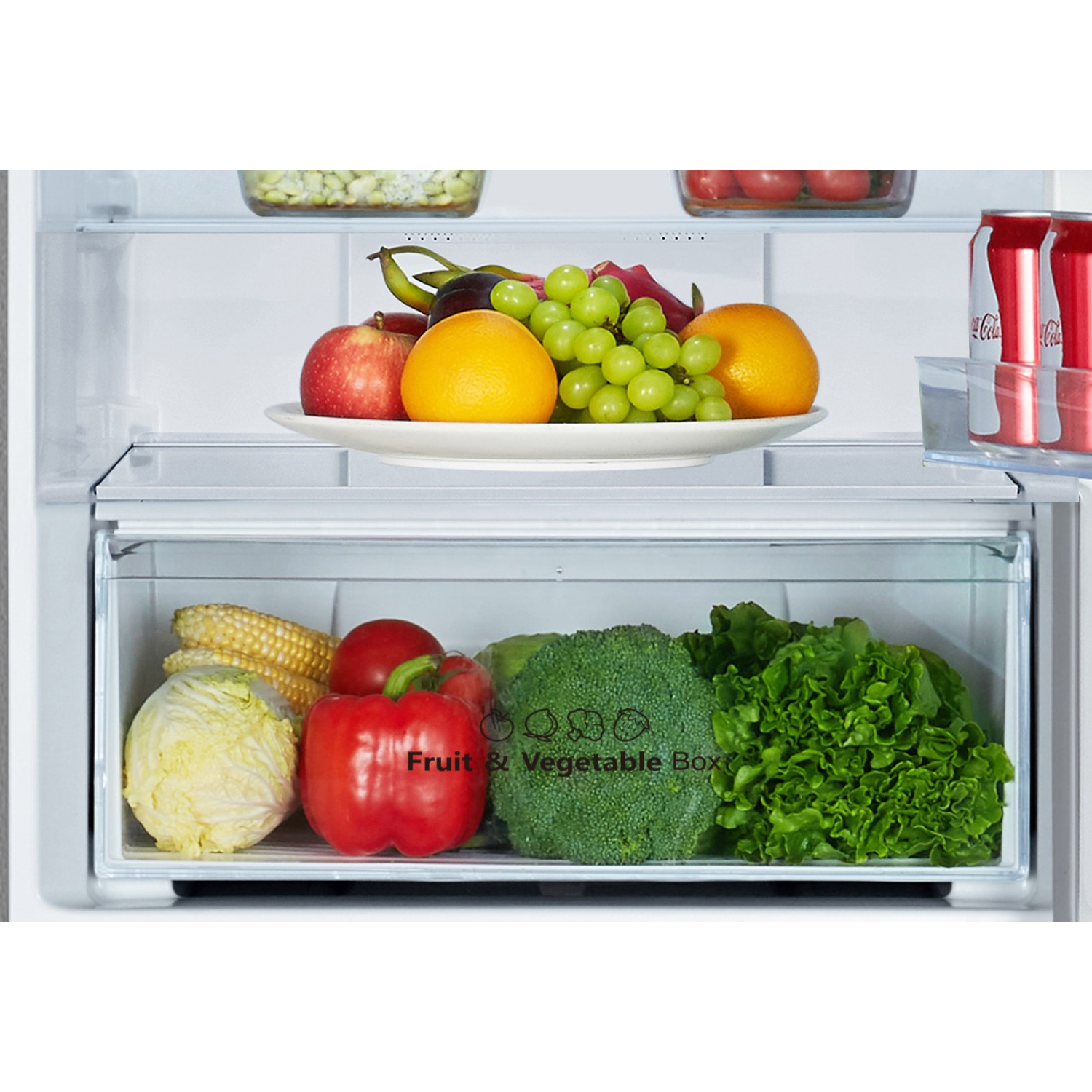 A refrigerator interior with fruits and vegetables in the crisper.