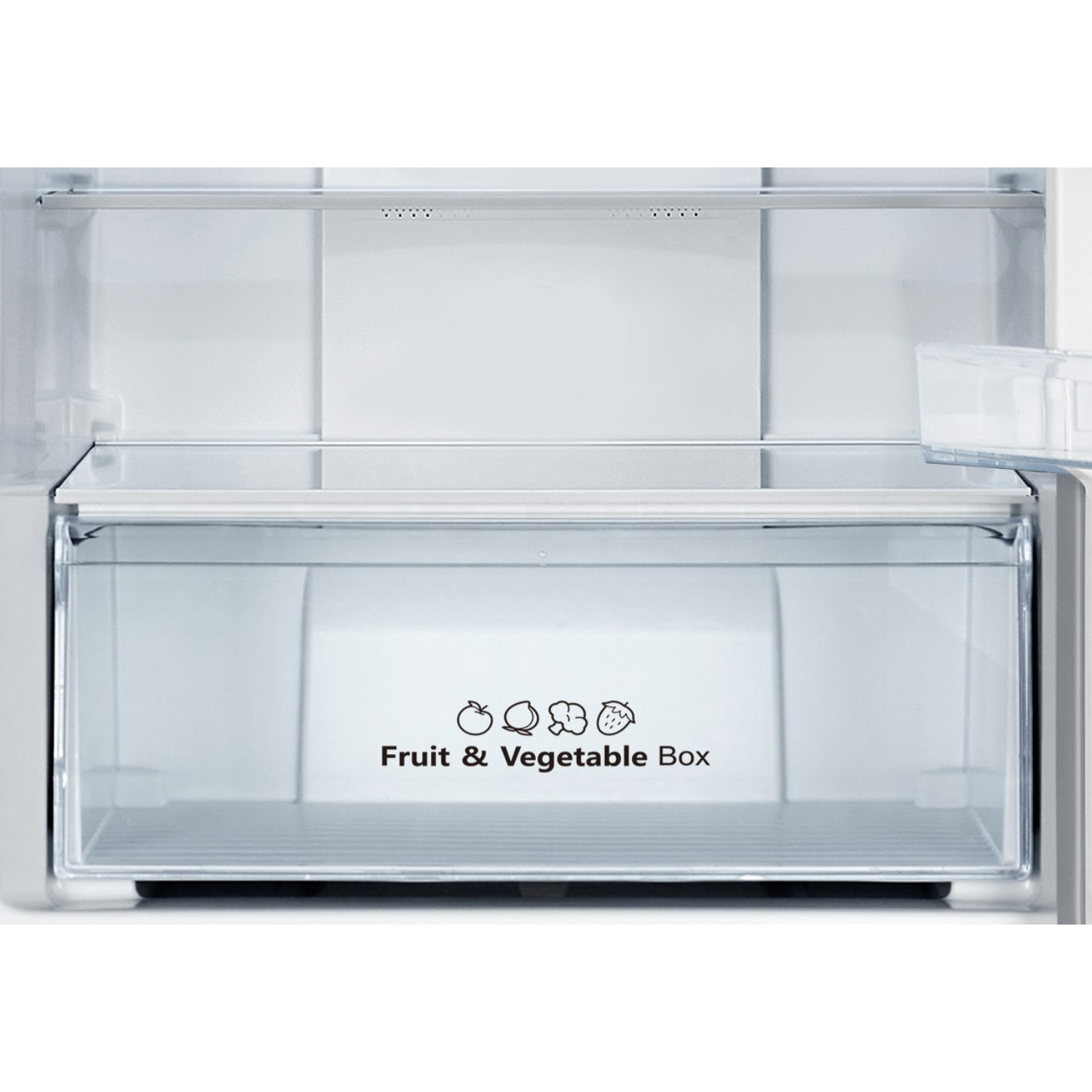 Inside a refrigerator, a fruit and vegetable box. The box is clear, with a white interior.