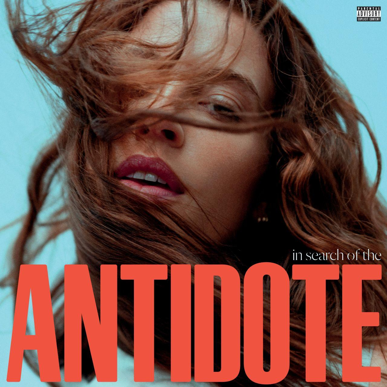Albumcover mit Frauengesicht und Text 'ANTIDOTE' in großen, orangen Buchstaben.