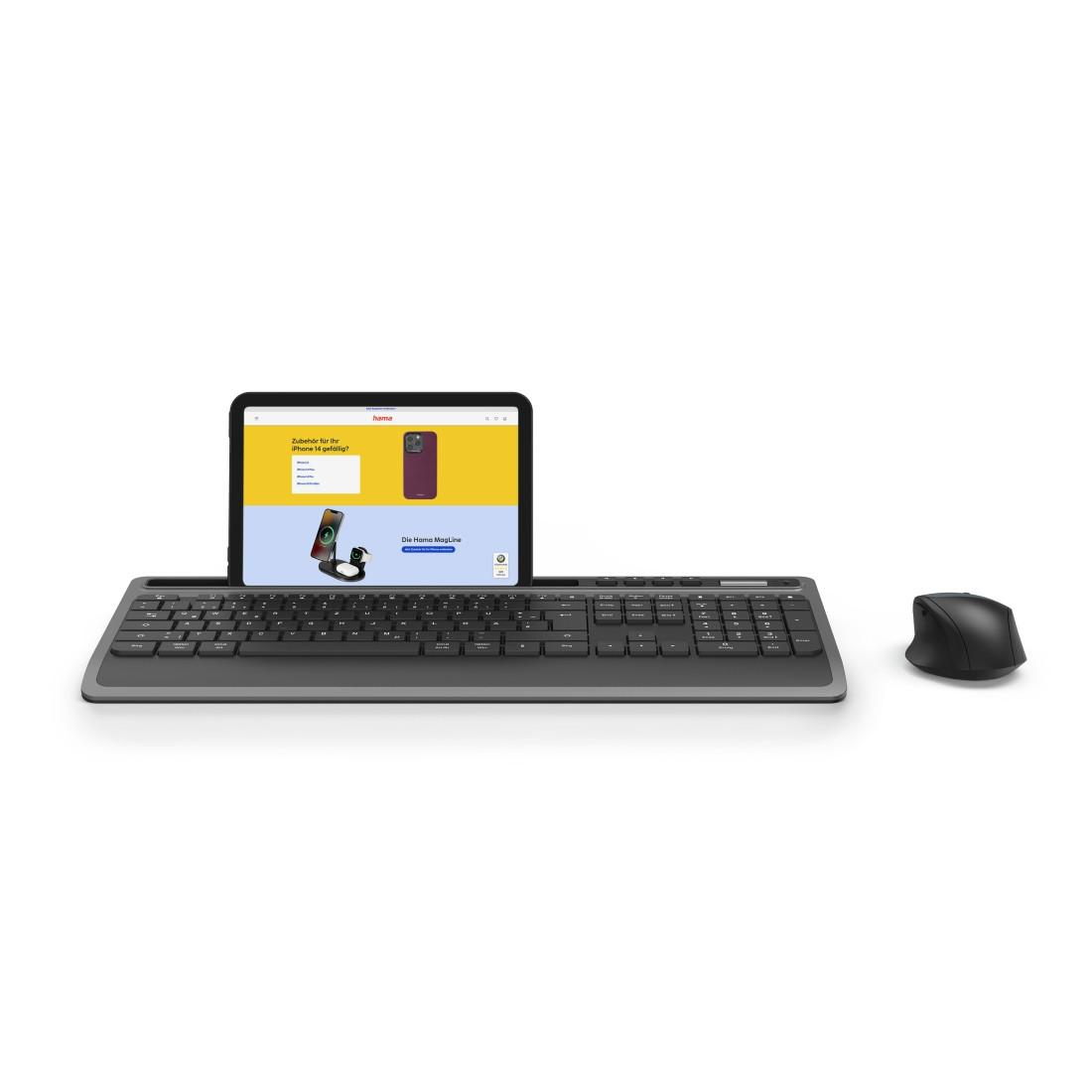 Une tablette sur un clavier, avec une souris, sur fond blanc.