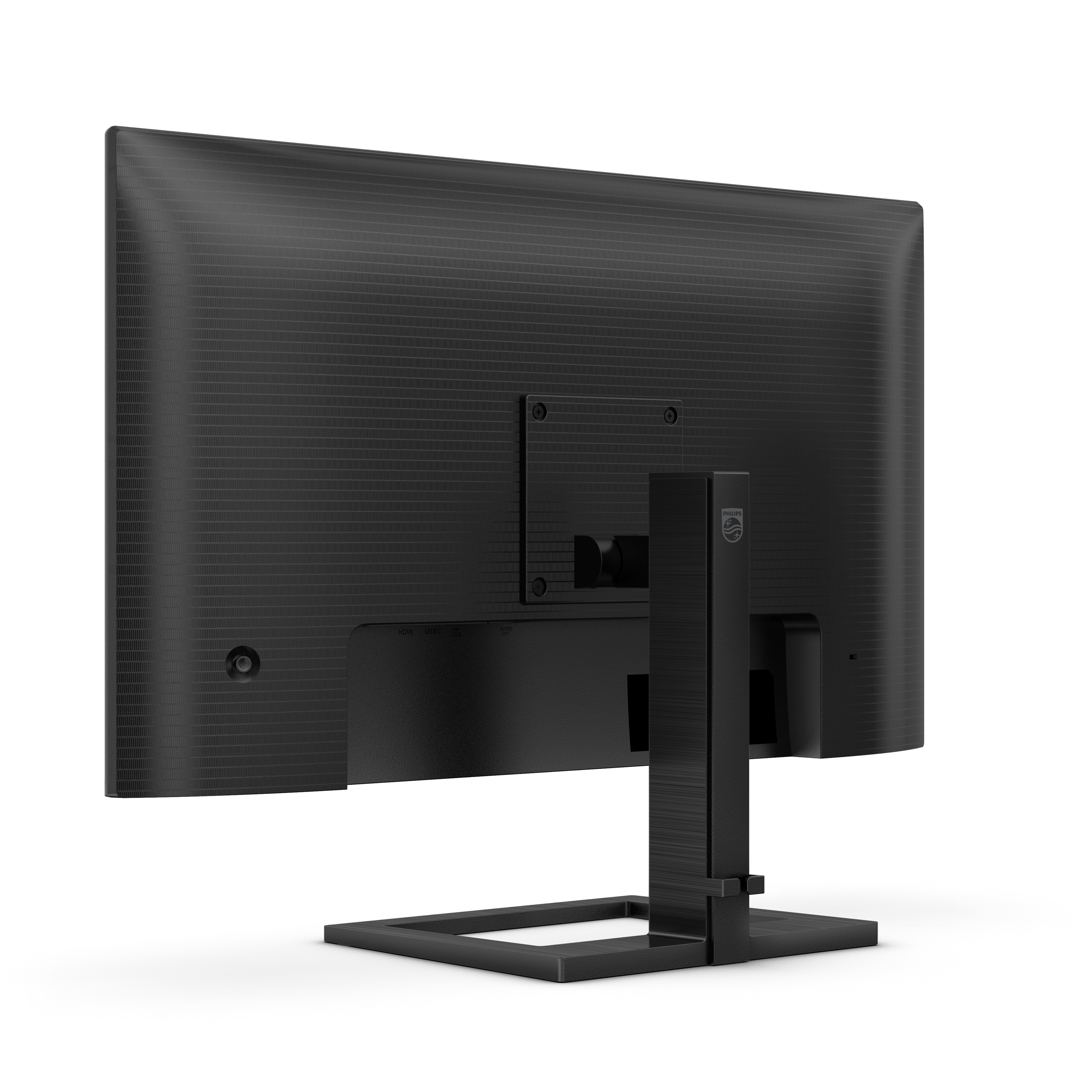 Ein schwarzer Computermonitor, Rückansicht, auf schwarzem Hintergrund. Der Monitor hat einen Ständer.