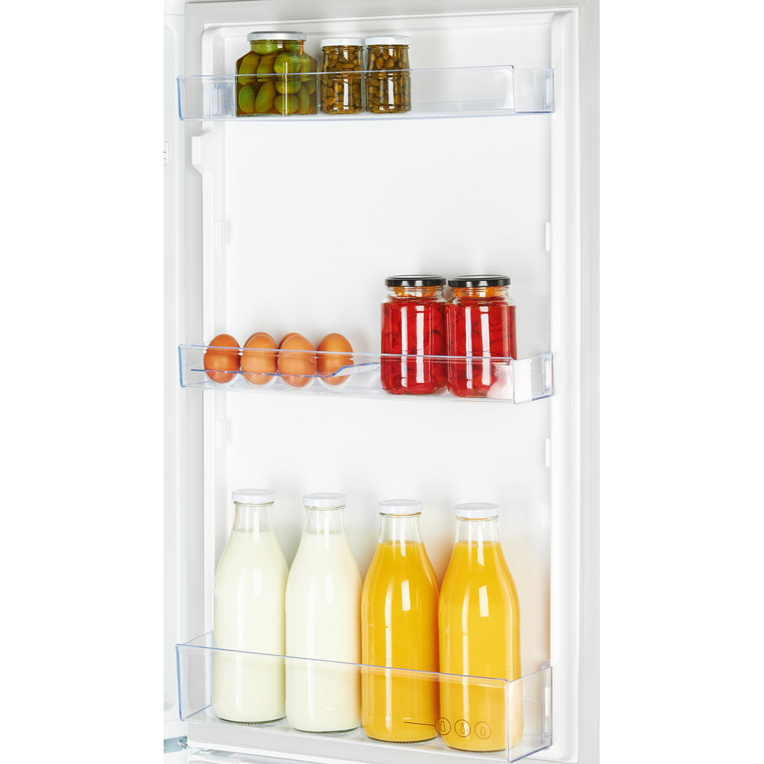 Refrigerator interior with shelves holding jars, eggs, and bottles.