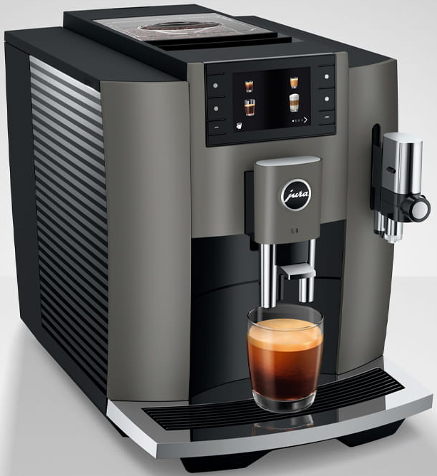 Macchina per espresso con un bicchiere di espresso. Schema di colori grigio e nero. Vista frontale.
