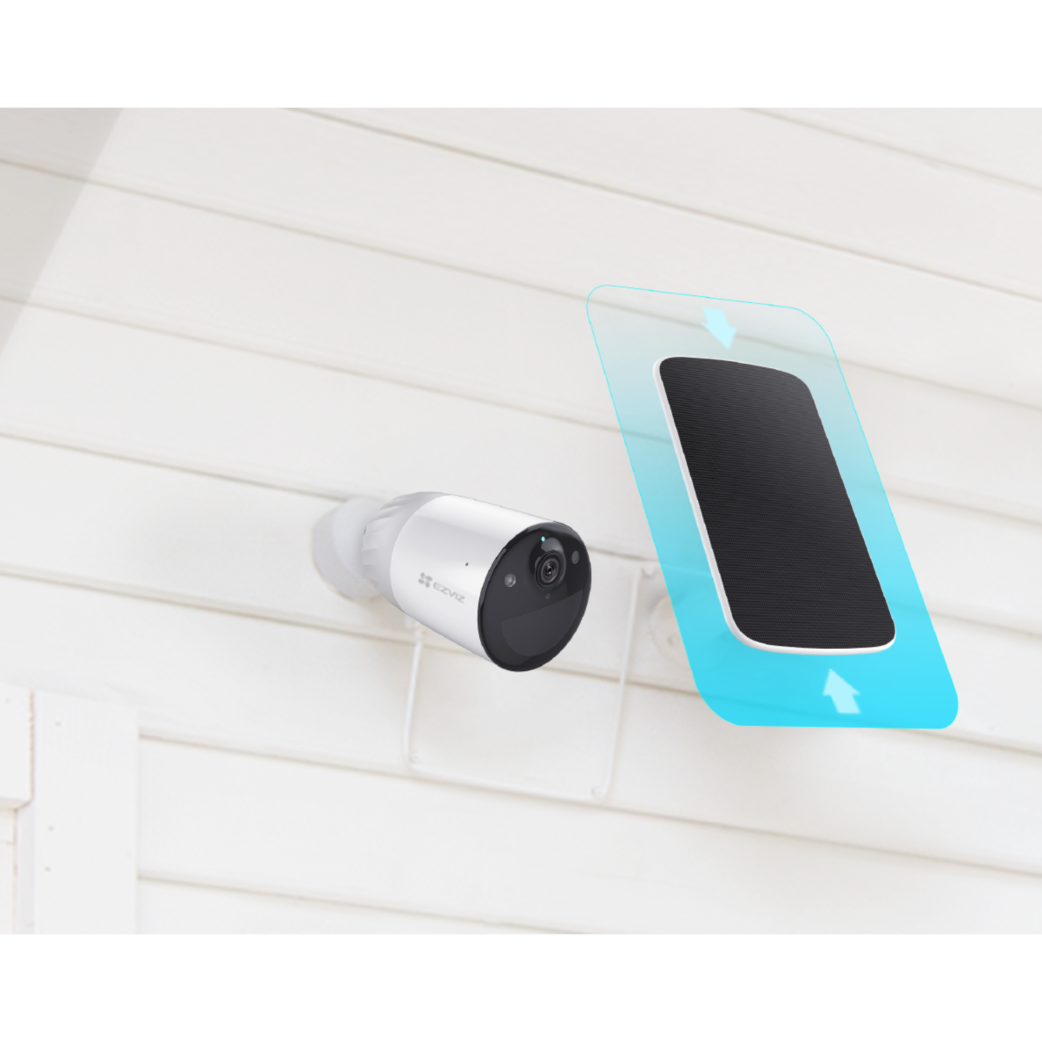 White security camera and solar panel. Blue arrows indicate energy flow. White siding background.