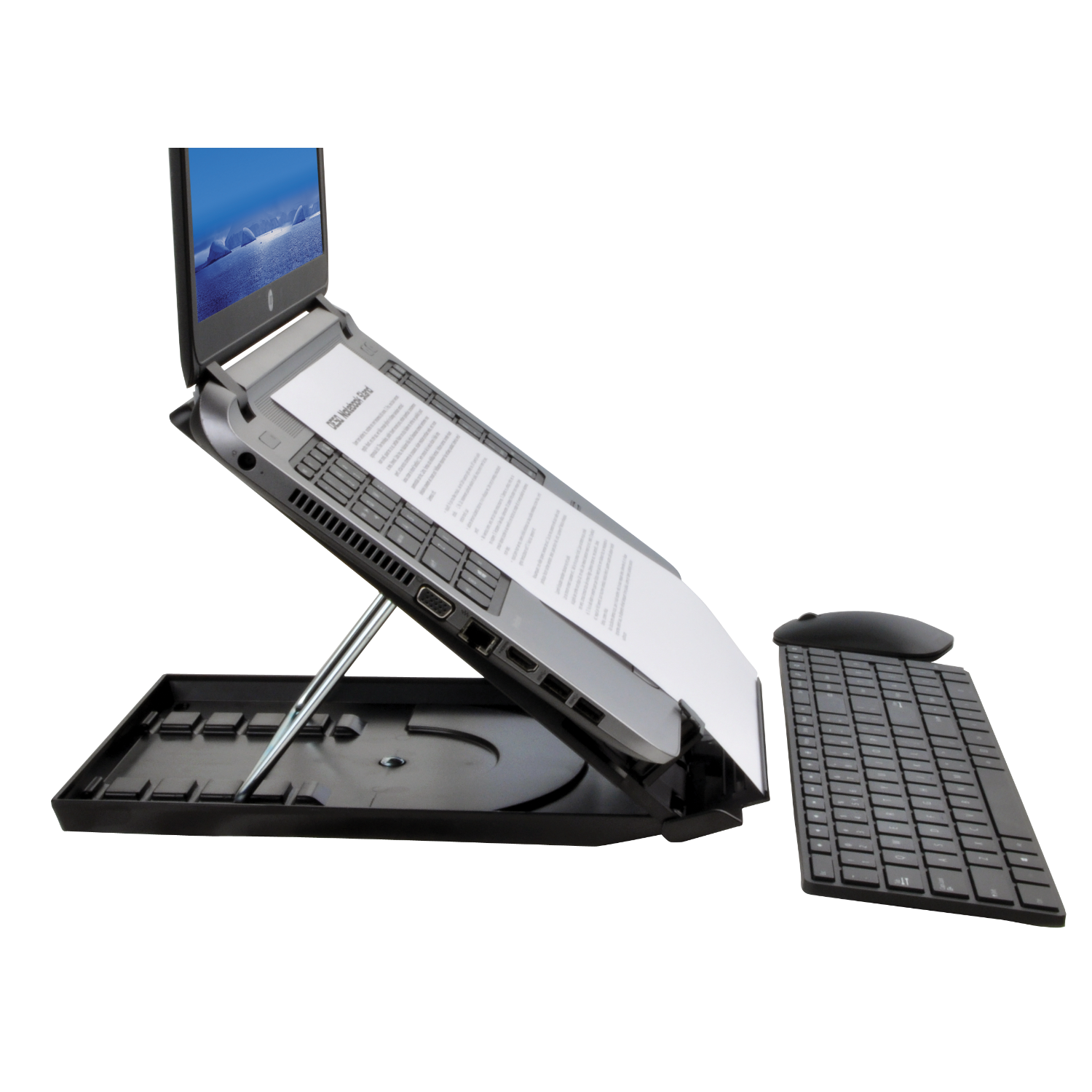 Laptop on a black stand with a separate keyboard, placed on a dark background.