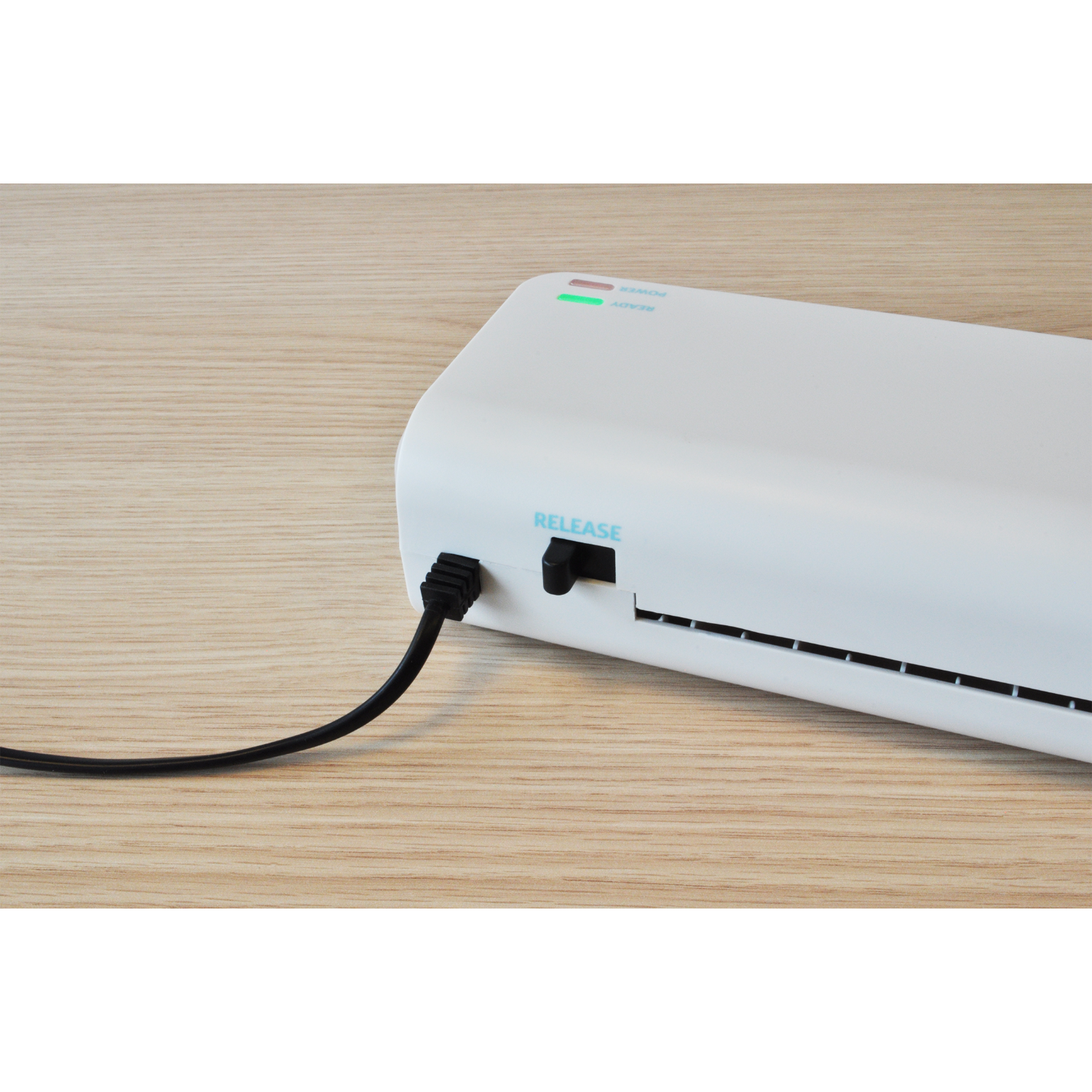 A white laminator machine with a black power cord. Green and red lights are visible.