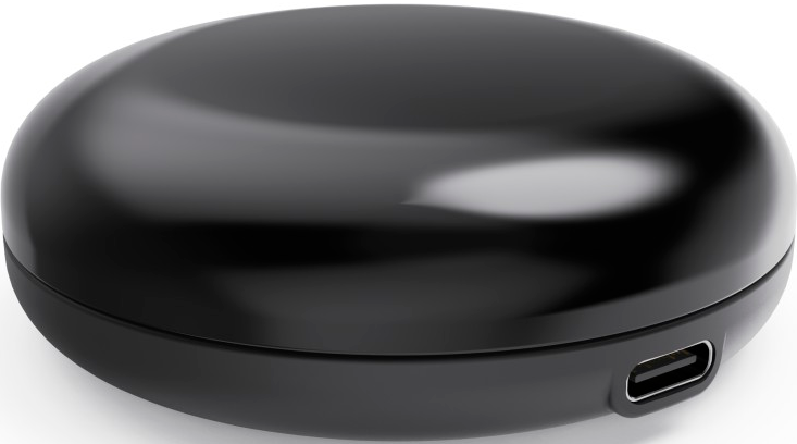 Ein schwarzes, rundes Gerät mit USB-Anschluss. Das Gerät befindet sich auf weißem Hintergrund.