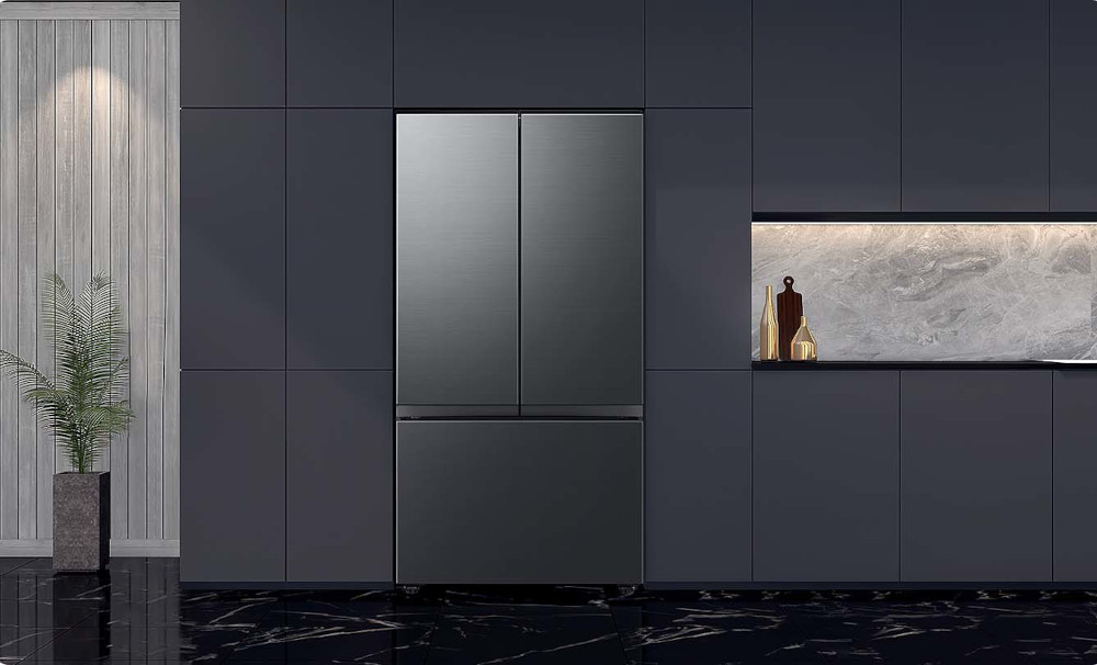 Réfrigérateur noir moderne avec doubles portes et tiroir congélateur inférieur.