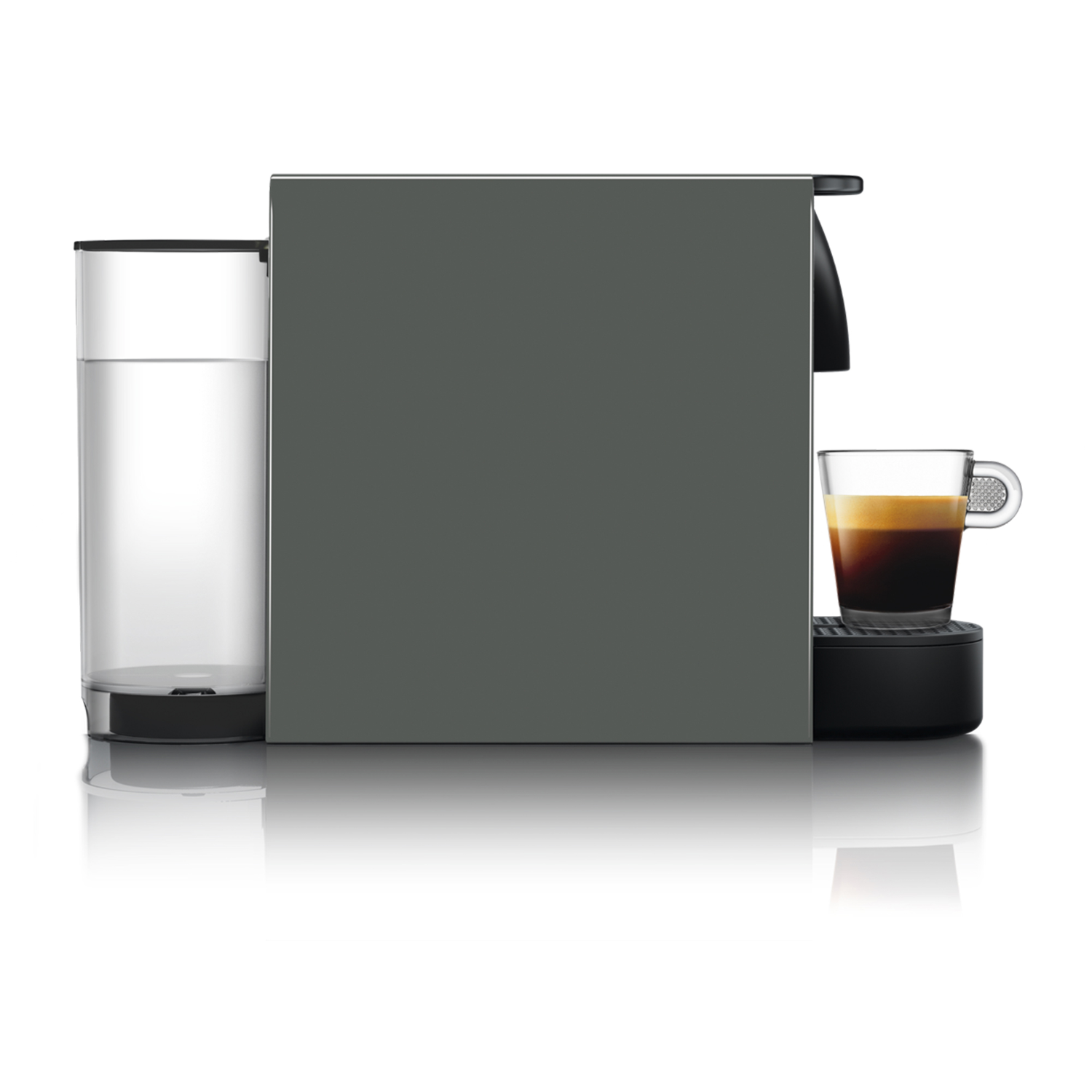 Gray Nespresso machine with water tank and a glass of espresso on a white background.