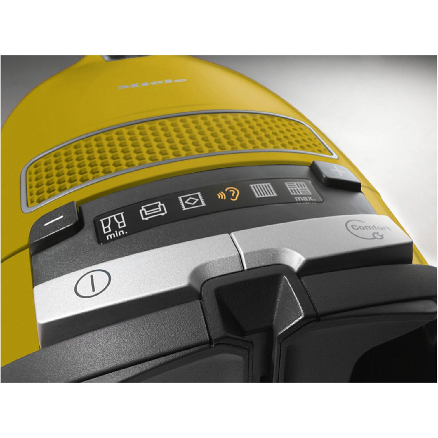 Un aspirapolvere giallo con pulsanti di controllo e un pulsante comfort. Viene mostrata la parte superiore.