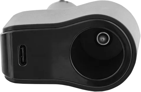 Gros plan d'un appareil noir avec port USB et une ouverture circulaire.