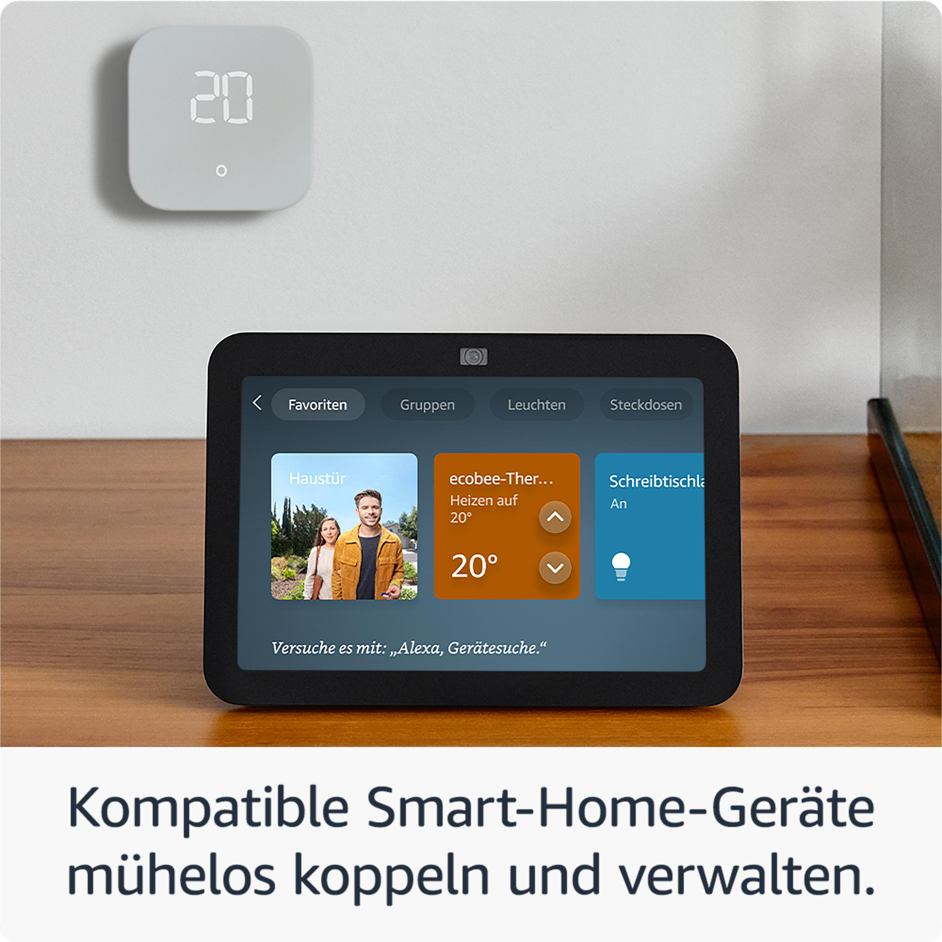 Smart Home Display mit verschiedenen Apps. Weiße Wand, Holzoberfläche.