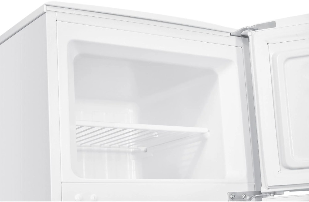 Inside of a white refrigerator, showing shelves and the inside of the door.