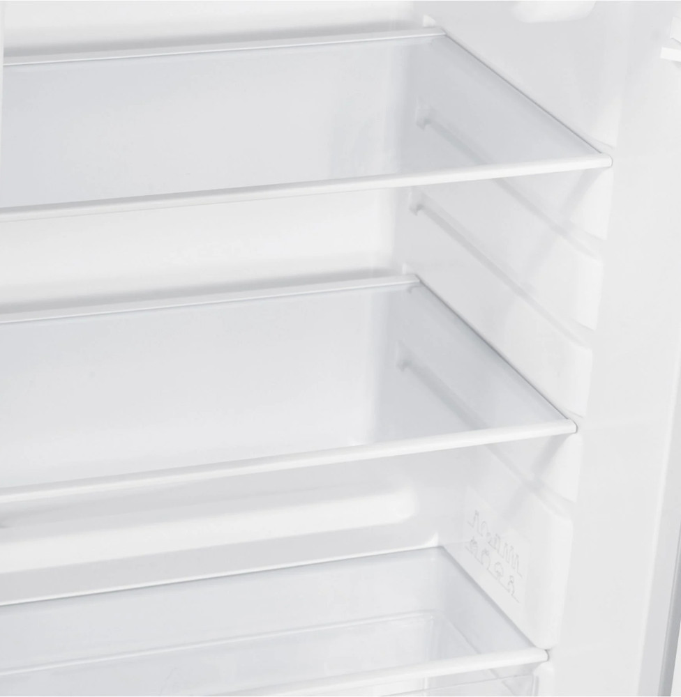 Interior of a fridge with glass shelves. Empty, white interior.