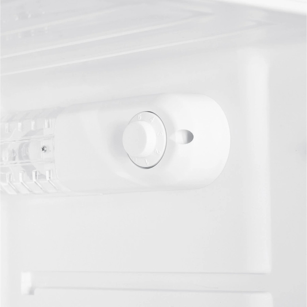 Close-up of a white dial inside a refrigerator, with numbered settings.