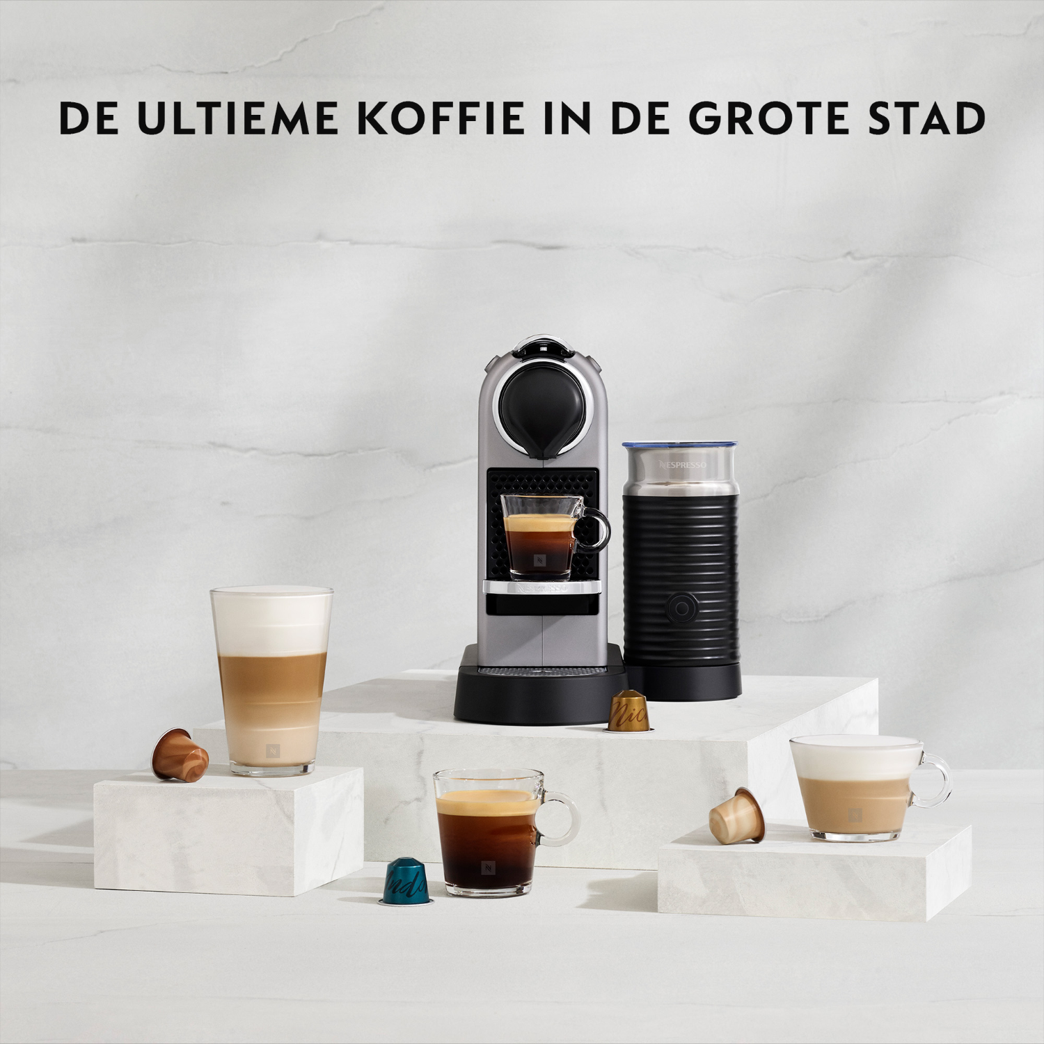 Coffee machine and accessories on a white marble surface, with various coffee drinks.