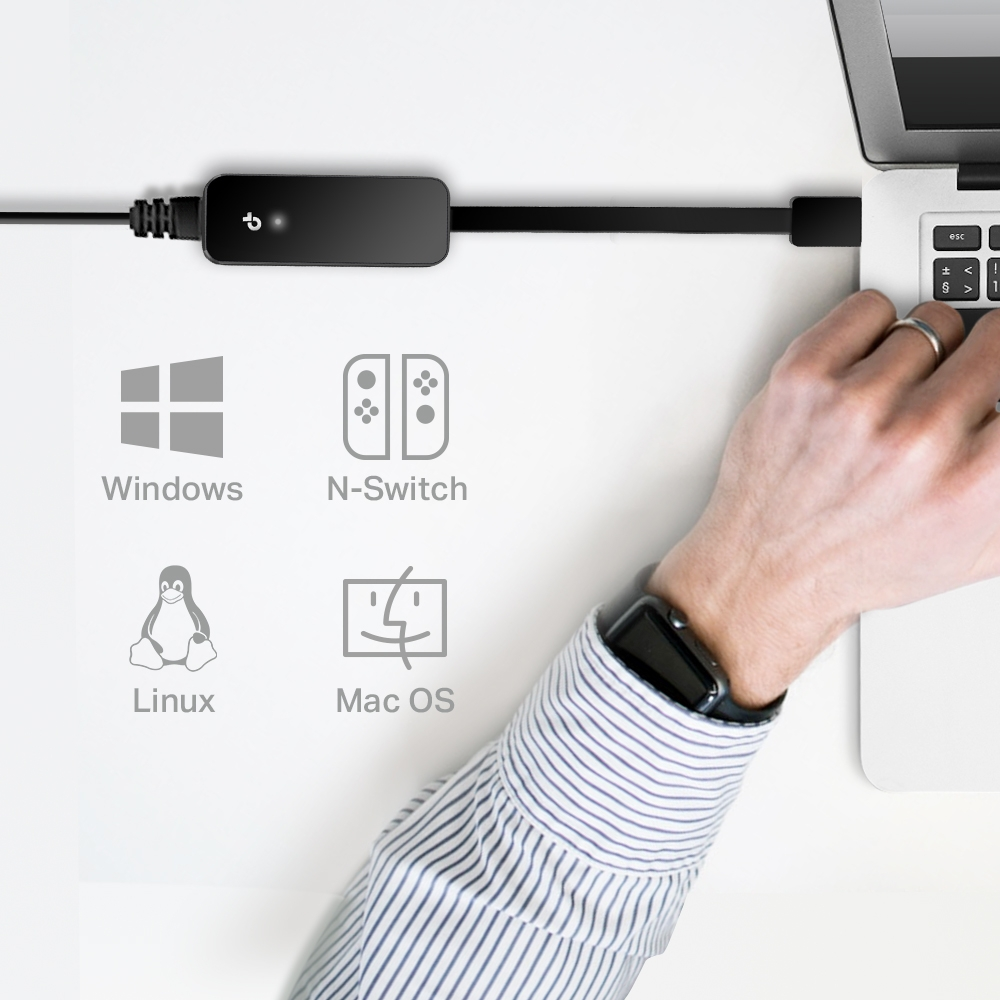 Bir dizüstü bilgisayara bağlı siyah bir dongle, Windows, N-Switch, Linux ve Mac OS simgeleriyle.
