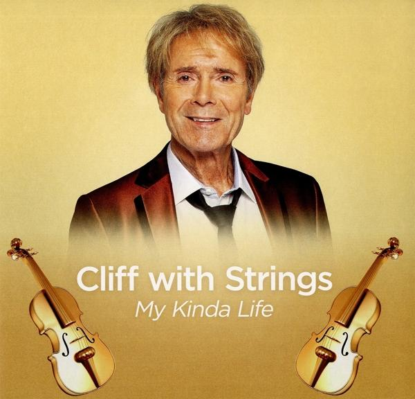 Férfi öltönyben, két hegedűvel, arany háttéren. Cím: Cliff with Strings.