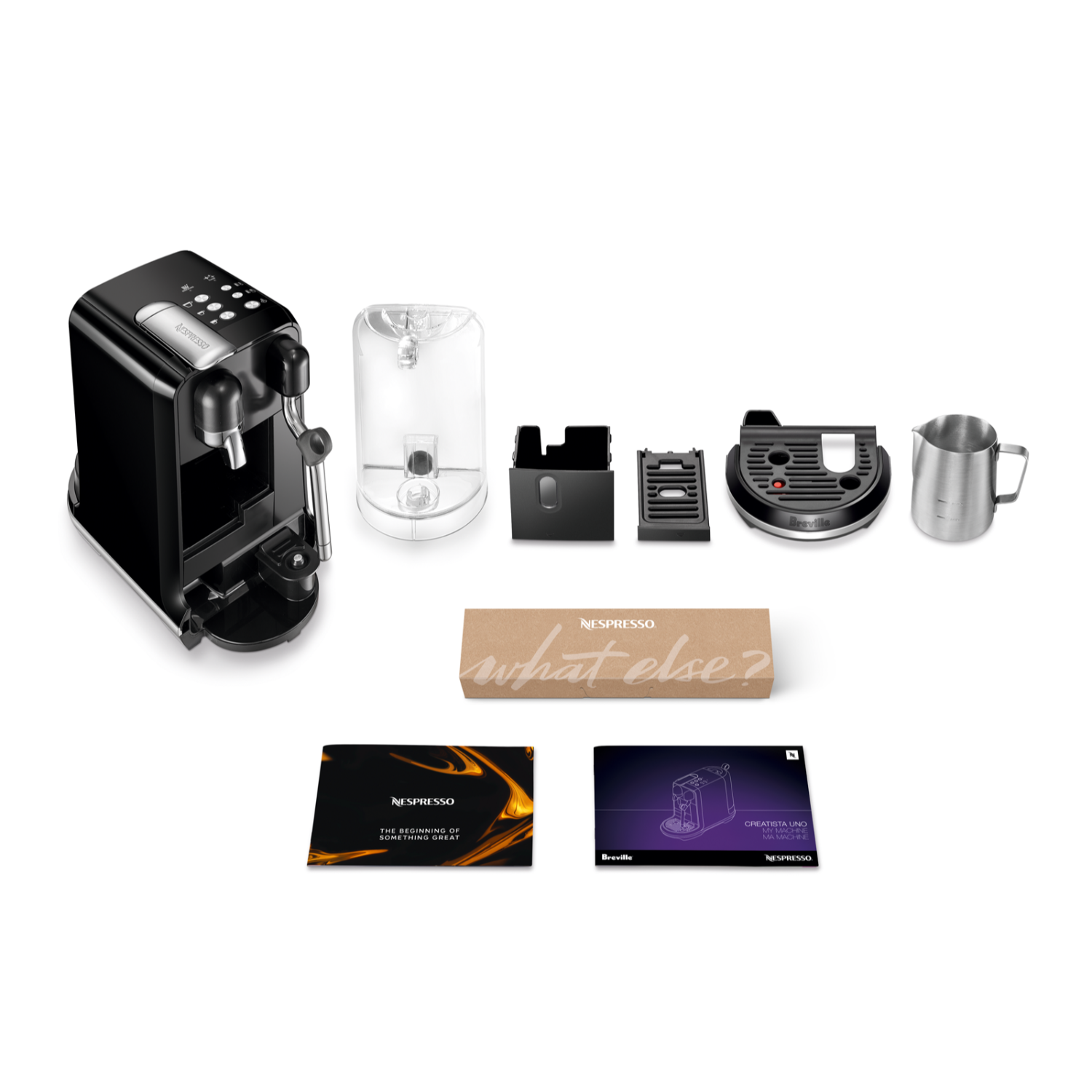 A Nespresso coffee machine with accessories, including a milk frother and cups.