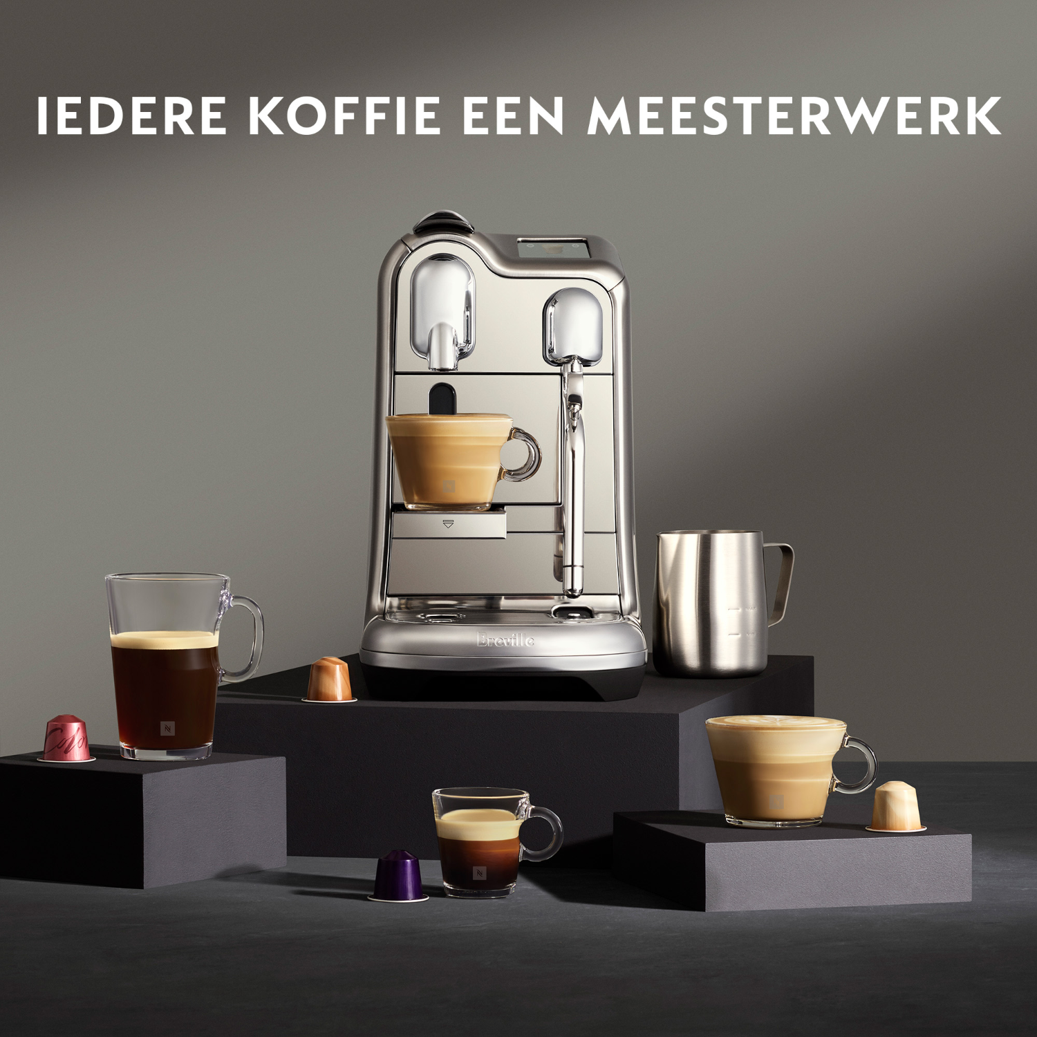 Espresso machine with coffee cups and pods. It's on a dark surface.