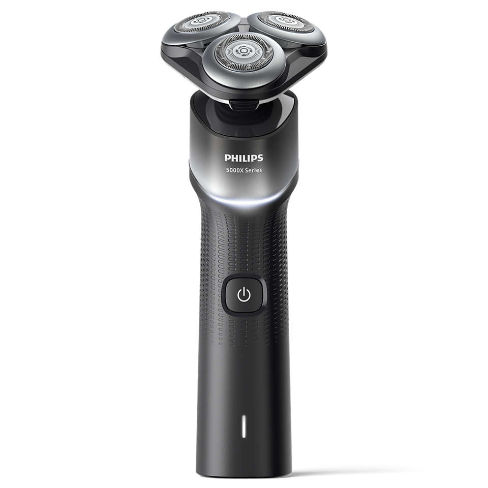 Fekete Philips borotva. Három forgófej, bekapcsológomb és töltőport.
