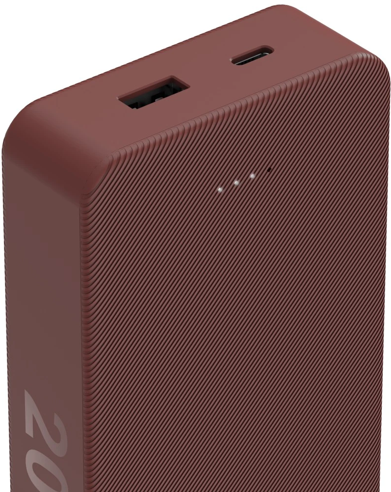 Eine weinrote Powerbank mit strukturierter Oberfläche und einigen Kontrollleuchten oben.