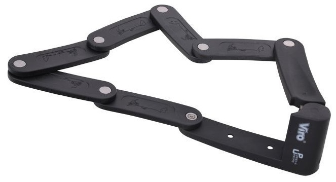 Czarny składany zamek do roweru, otwarty i rozłożony, z wieloma przegubowymi segmentami i metalowymi szpilkami.