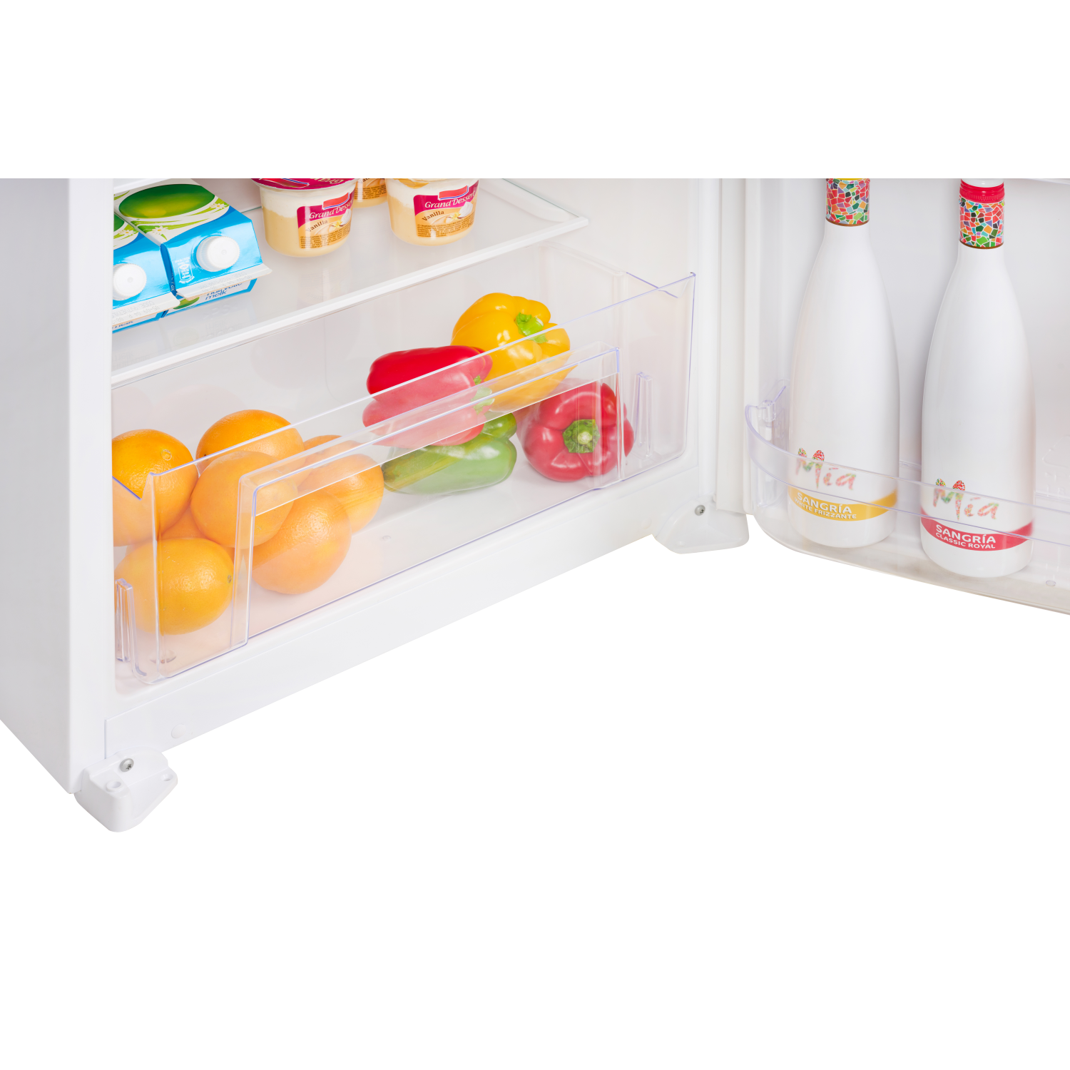 Refrigerator interior with oranges, peppers, and bottles of Mia Sangria. White interior.