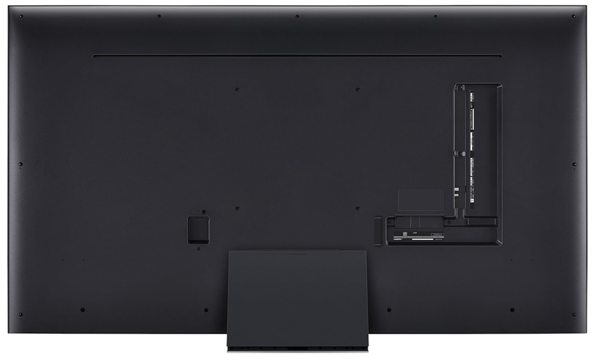 Tył dużego czarnego telewizora. Widoczne porty i stojak. Czyste tło.