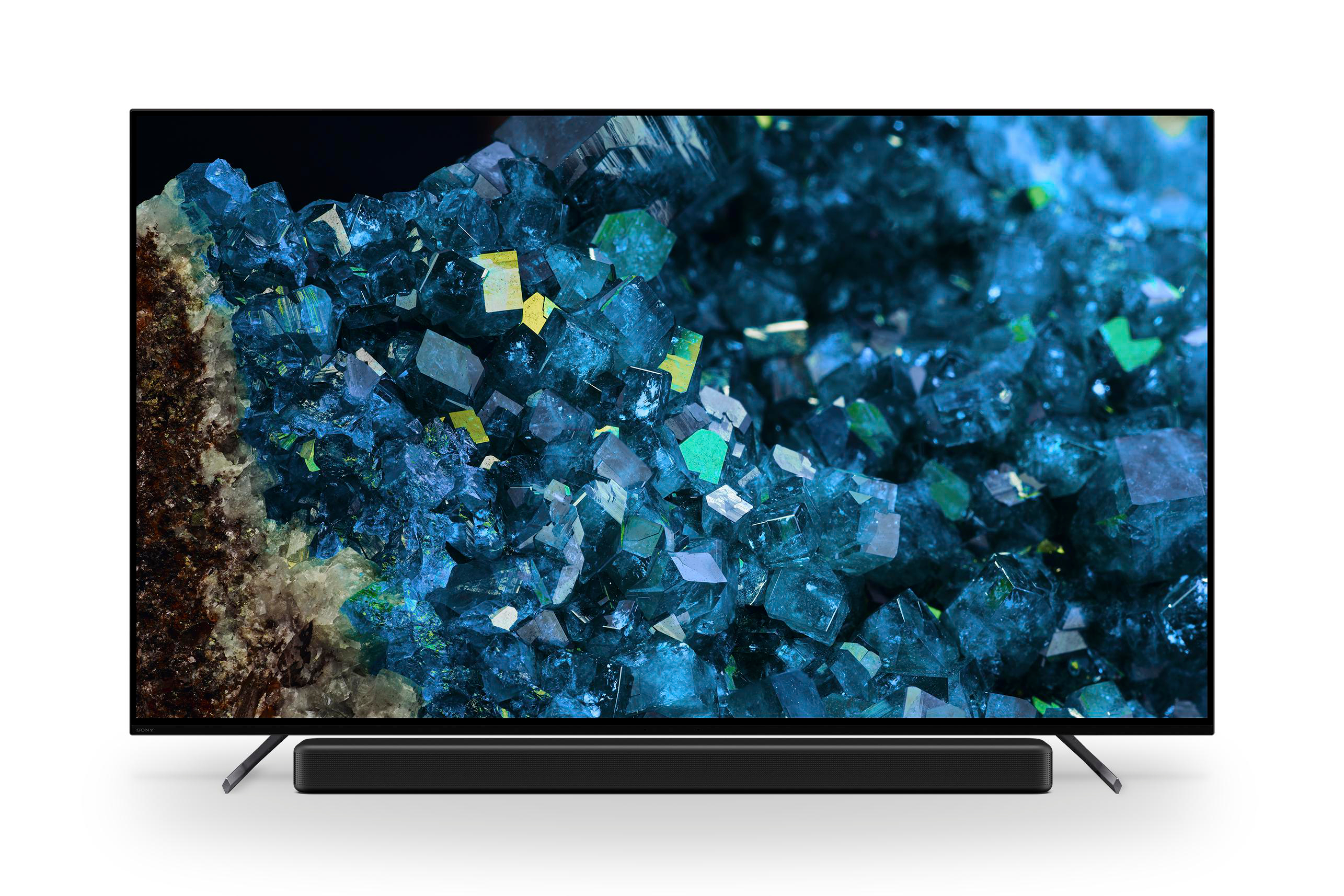 Ein Fernsehbildschirm zeigt ein abstraktes Bild blauer Kristalle und eine Soundbar.