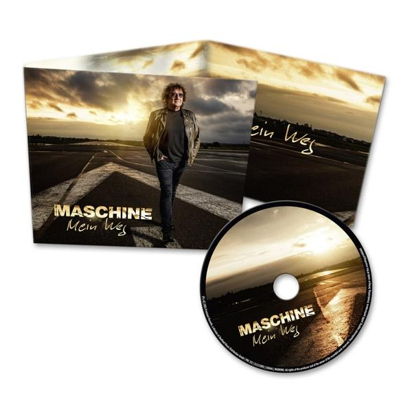 Eine CD mit Albumcover und ein Buch mit dem Albumcover, das einen Mann auf einer Straße bei Sonnenuntergang zeigt.