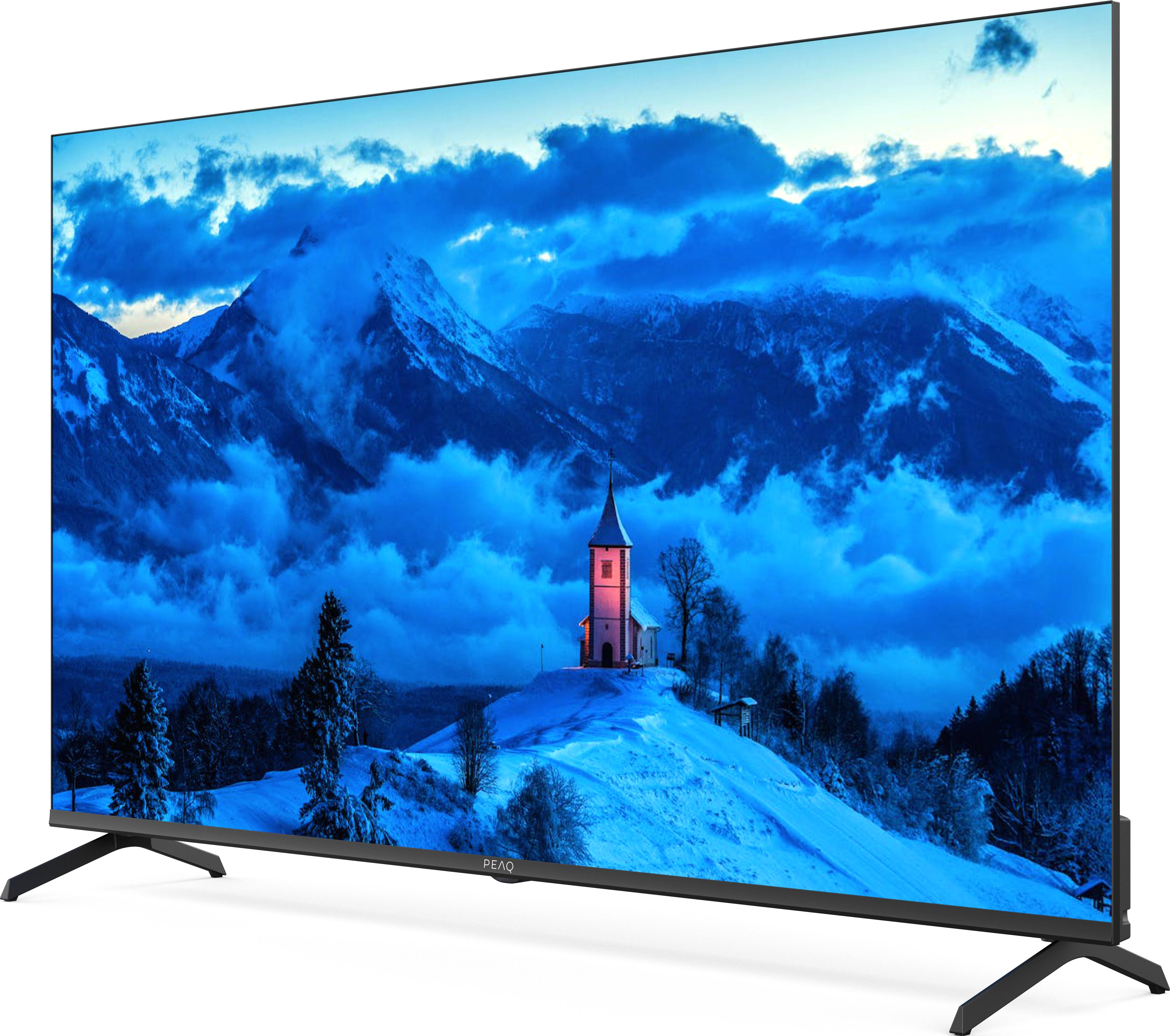 Televisore a schermo grande con paesaggio montano innevato con sfumature blu.