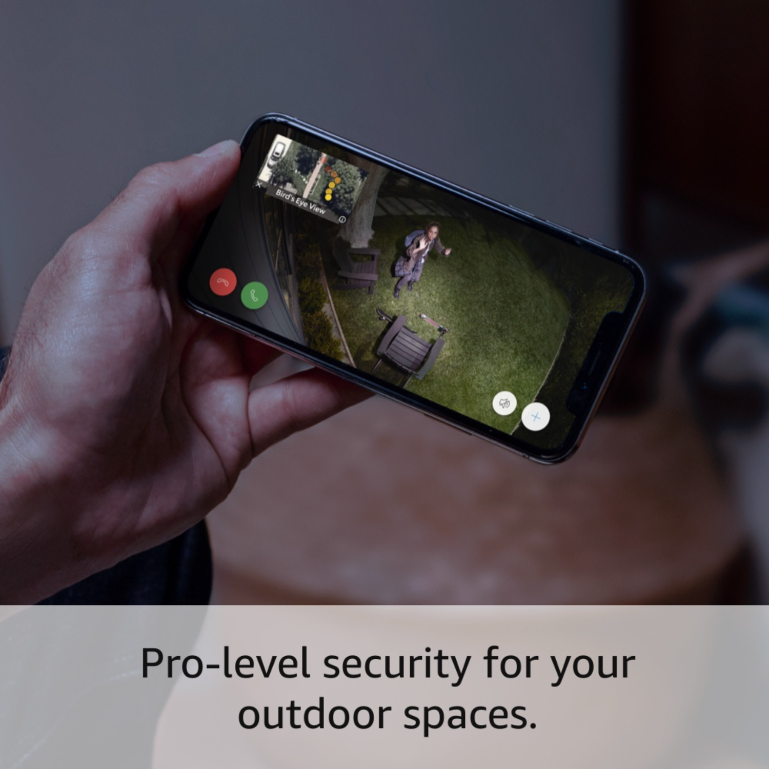 Hand holding phone showing a backyard view, with text 'Bird's Eye View'.