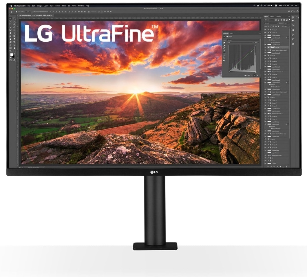 Monitor LG UltraFine z pięknym krajobrazem zachodu słońca na ekranie.